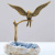 Статуэтка Бронзовая птица (Взмах крыльев) на жеоде агата